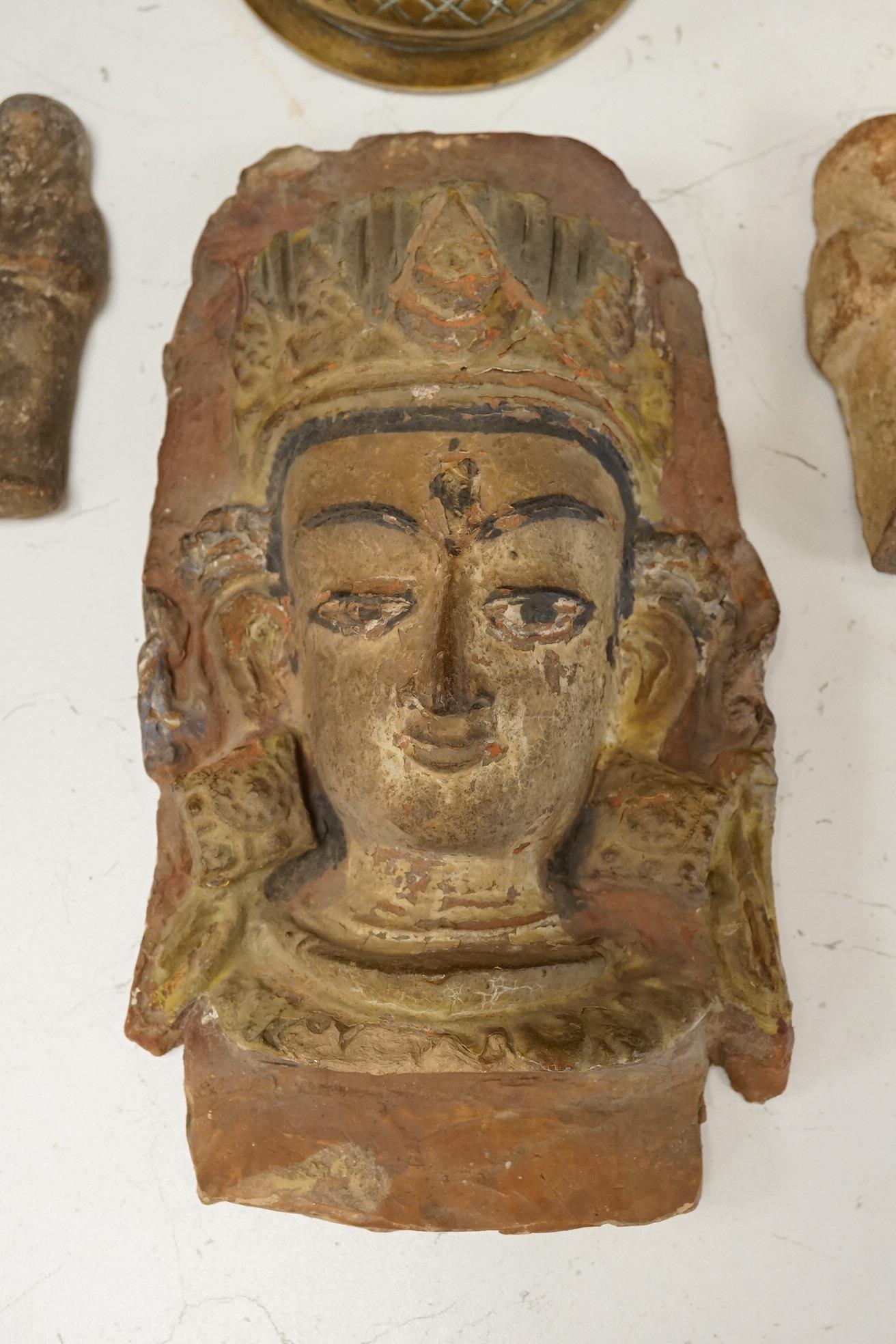 A South-East Asian bronze censer, two Ushabti and an Egyptian painted terracotta mask, 24cm
